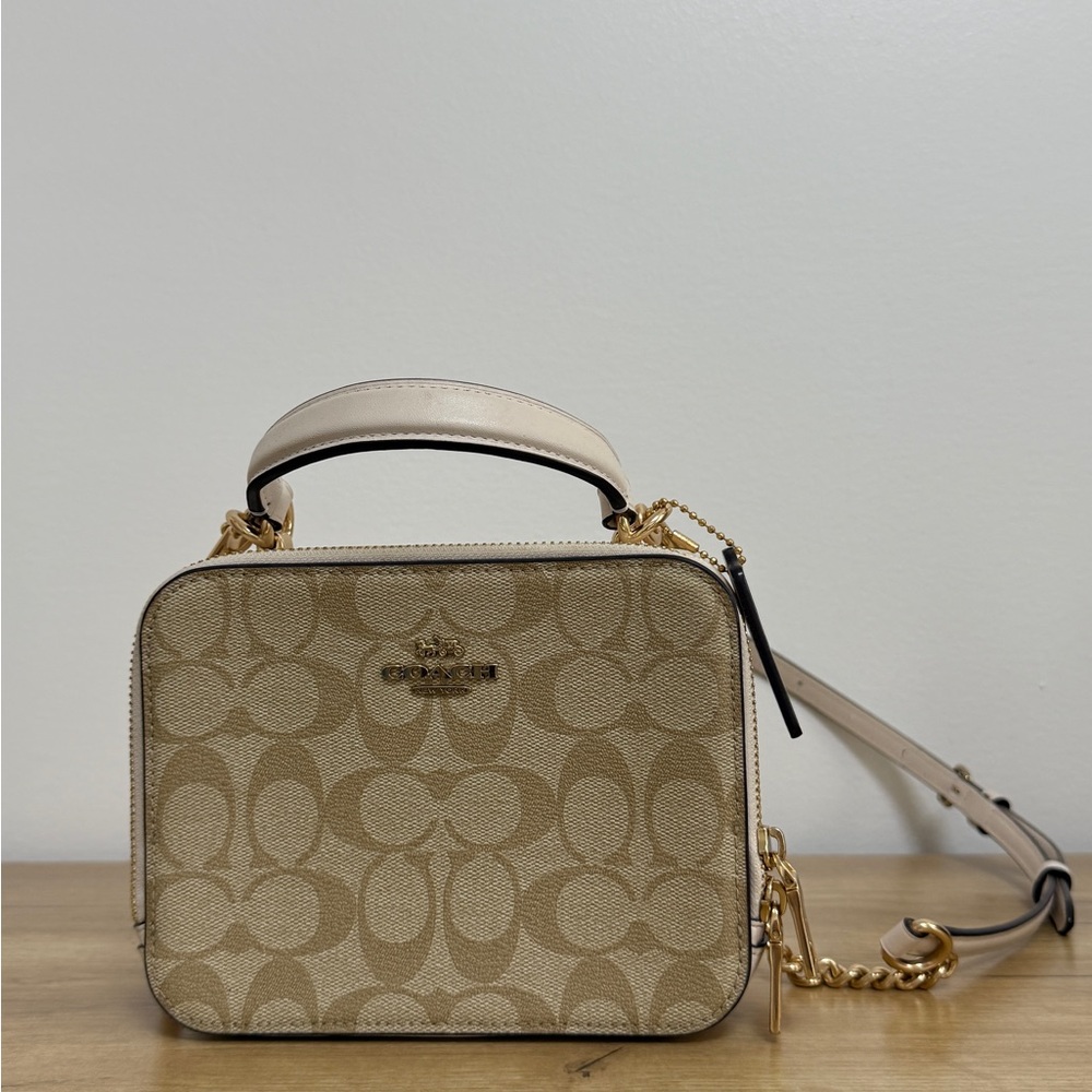 Coach Tan Crossbody Bag with Monogram Pattern and Gold Hardware